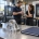 Generic machined bracket and project folder with manufacturing professionals in a CNC shop